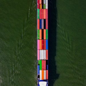 a large boat with a lot of colorful containers on it