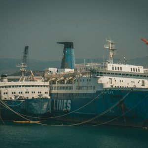 white and blue ship on sea during daytime