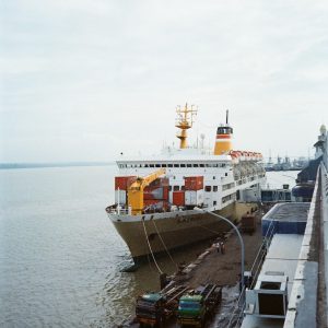 a large cruise ship docked at a dock
