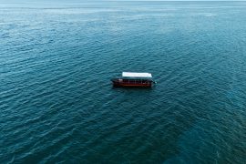 a boat floating on top of a large body of water